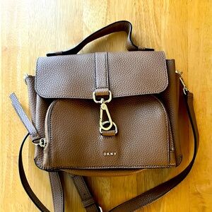 DNKY tan leather crossbody bag with gold accents.  Like new condition